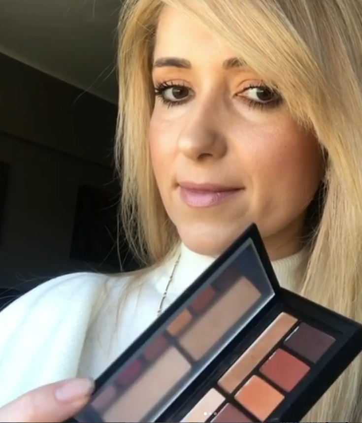 Marzena showcasing her makeup palette collection